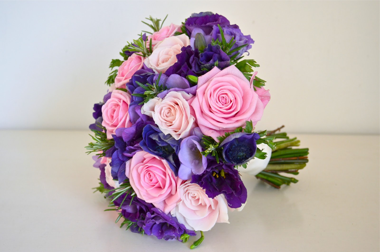 pink rose purple anemone lisianthus freesia bouquet