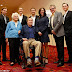 Former US president George HW Bush apologises after actress claims he 'sexually assaulted' her from his WHEELCHAIR in this photograph - with his wife Barbara standing by his side