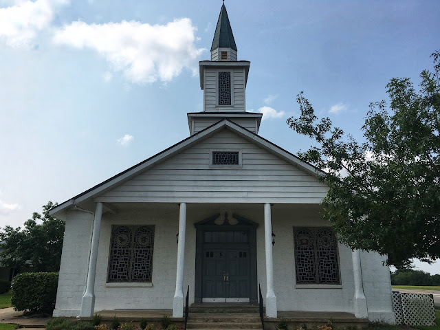 white wooden church in small town texas