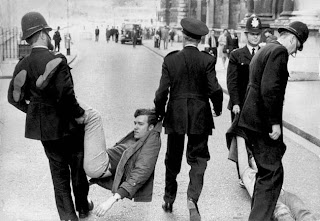 A young trouble-maker carried off by the police!