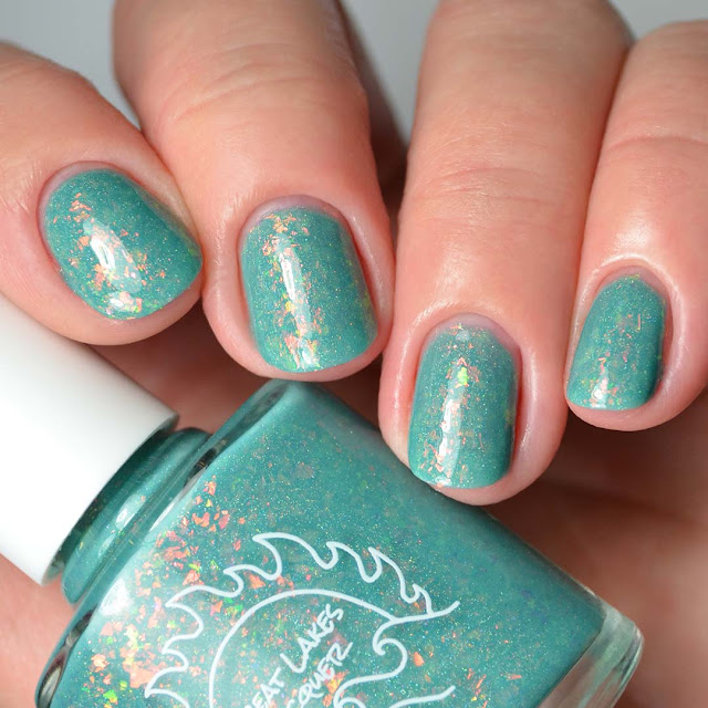 teal nail polish with flakies swatch