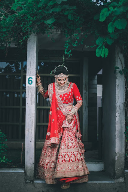 A woman in red Lehenga