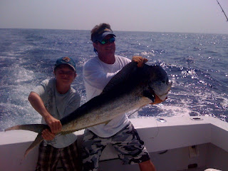 boy with big bull dolphin