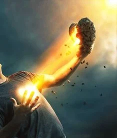 Man with love shape on his heart oozing out firy lrays of light