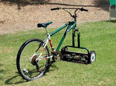 bicycle with lawn mower blade for the front wheel