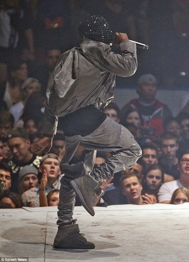 Kanye West wears Red Air Yeezy 2 Sneakers and Margiela Sneakers on ...