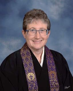 Female Buddhist Priest in Black Robes and Purple Wagesa