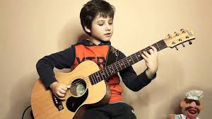 kid-playing-guitar