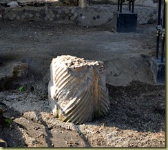 Pillar at end of peristyle