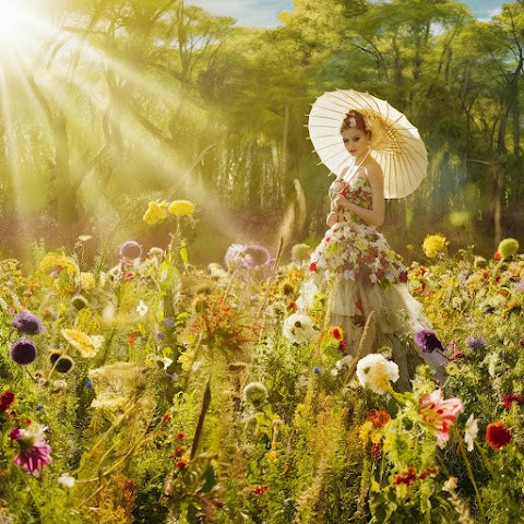 Teenager girl walking in a flower garden