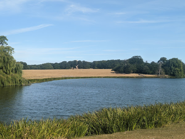 Lake at Holkham Estate, with church in background