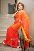 Sony Charista Glamorous in Saffron saree-thumbnail-8