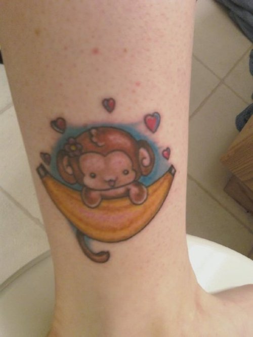 Baby monkey with banana ankle tattoo for girls.