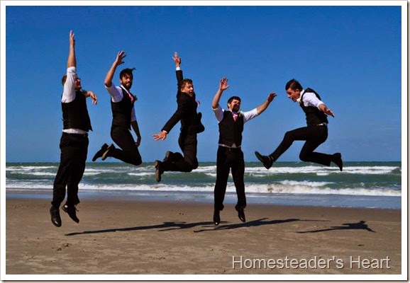 boys jumping beach