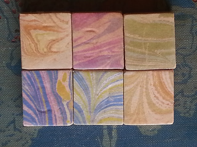 Scrabble tiles decorated with marbled paper