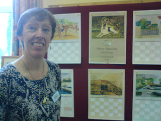 Jill Barnard with proofs of calendar