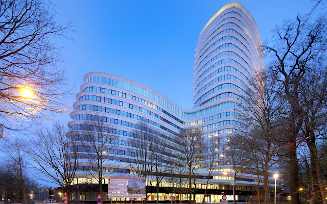 Picture of the office building at sunset as seen from the street