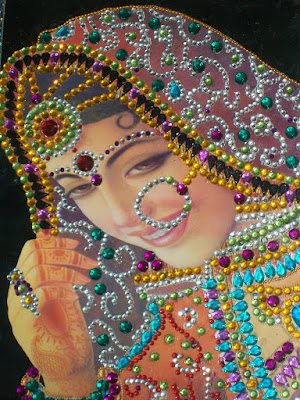 This is the portrait of Indian bride made with gem stones.