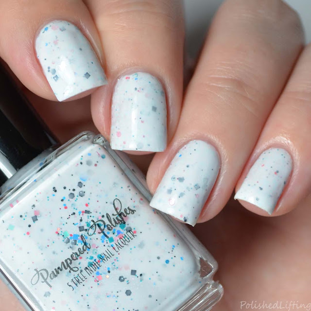 white crelly nail polish with glitter