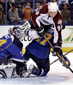 Ryan Smyth flys through the air during the first period