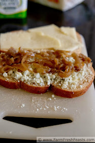 making a grilled cheese sandwich with gorgonzola, caramelized onions, and havarti