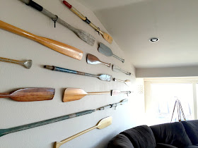 An oar gallery wall.  Perfect for a large wall in a beach home!