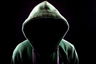 Man in a hood dark image