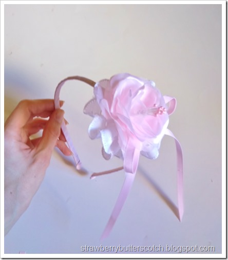 Making a flower and lace headband.  Add a ribbon bow and anyother embellishments you want, then you're done!