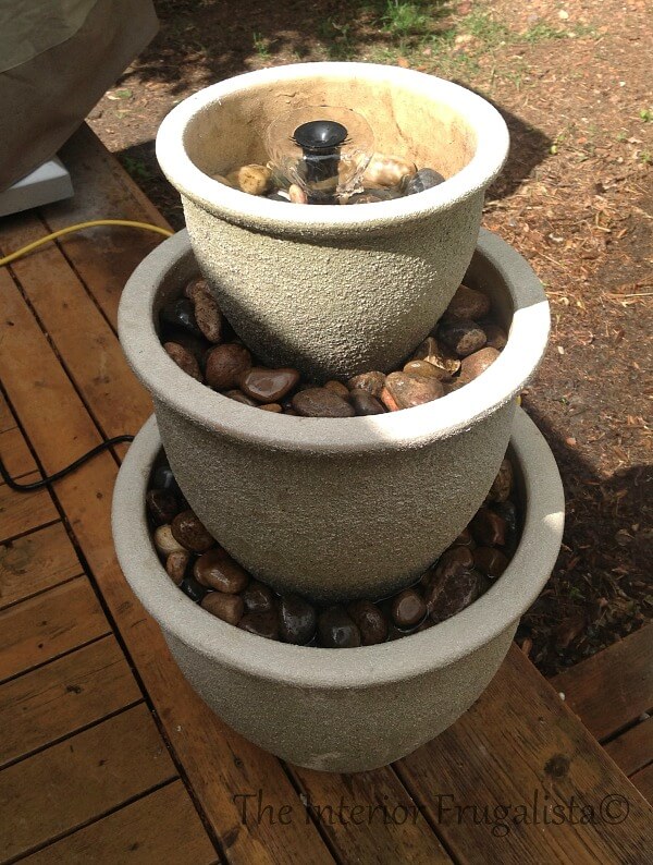 This budget-friendly DIY Plant Pot Water Fountain is the perfect water feature for a deck, patio, porch, or balcony using a trio of flower pots.