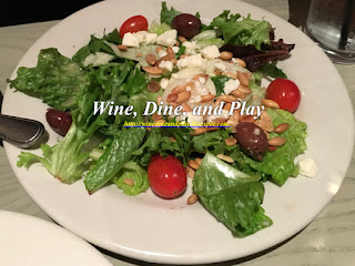 A side salad with hearts of palm, tomato and an Italian vinaigrette at the Bonefish Grill in St Petersburg, Florida