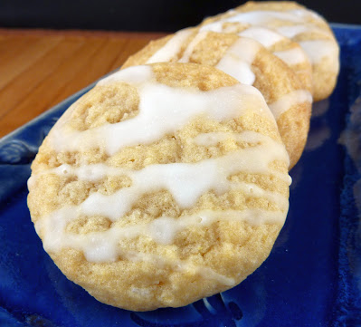 Honey Cookies drizzled with a simple honey glaze, photographed on an oblong blue plate