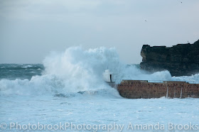 Waves crashing up at Portreath beach Cornwall