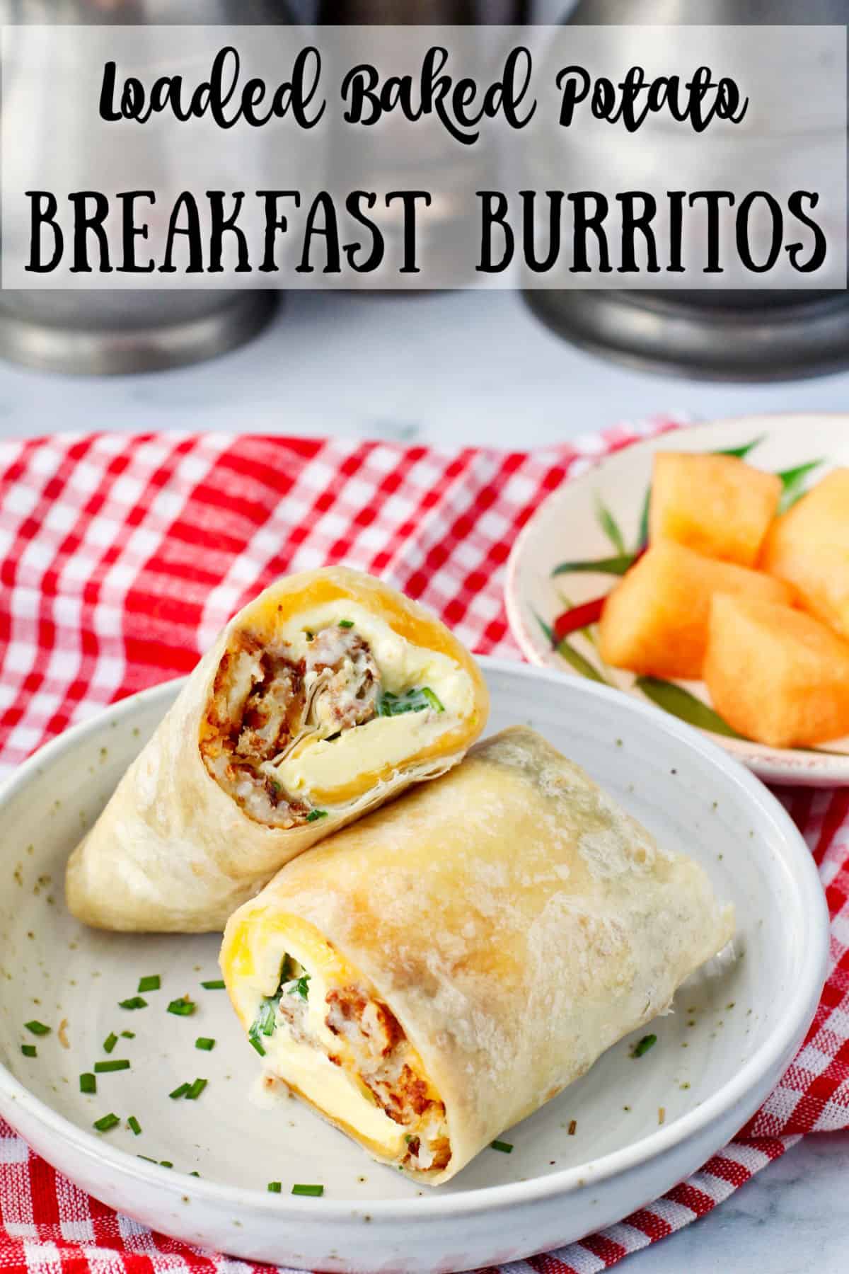 Loaded Baked Potato Breakfast Burritos cut and stacked in a bowl.