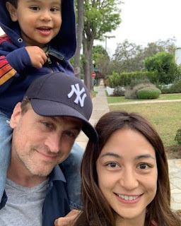 Karen Riotoc Moscow clicking a selfie with her husband David & their son