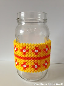 Hama beads wrapped around a jam jar