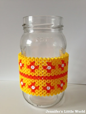 Hama beads wrapped around a jam jar