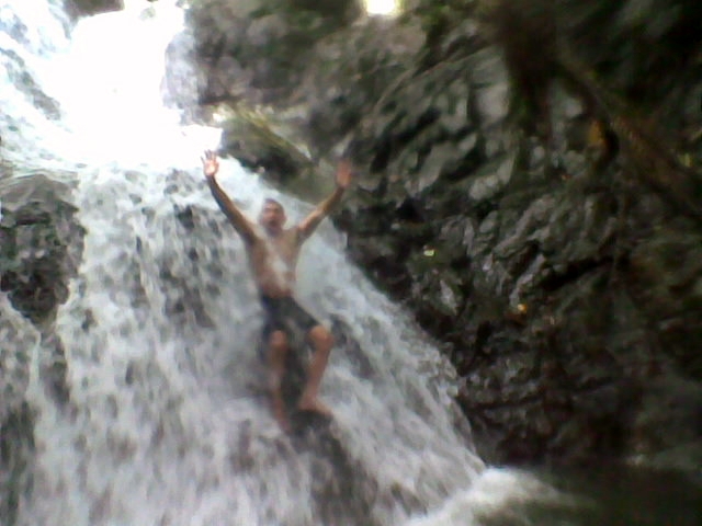 Enjoying the clear cool water of the falls