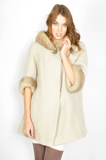 Vintage 1960's creme colored wool coat with mink collar and cuffs and button front closure.