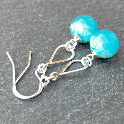 Earrings made with handmade lampwork glass by Laura Sparling