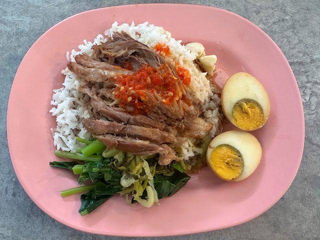 Thai-Chinese pork leg stew street food lunch in Bangkok, Thailand