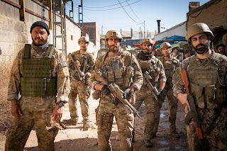 Dar Salim, Jason Wong, Jake Gyllenhaal, Christian Ochoa, Rhys Yates in Guy Ritchie's "THE COVENANT"