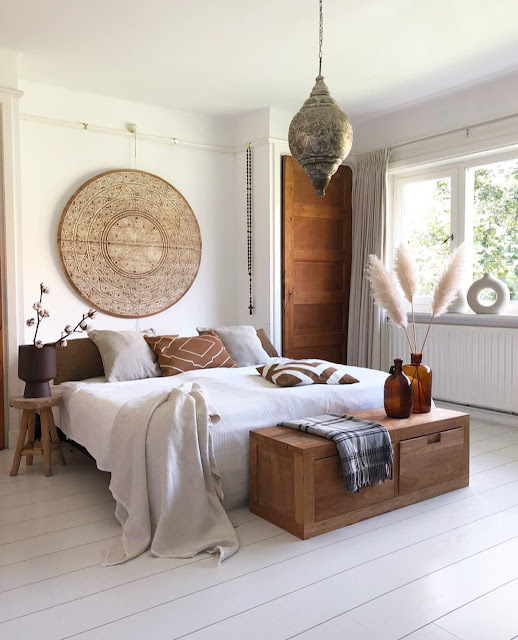 neutral bohemian bedroom with white modern donut vase