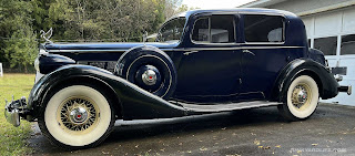 Wire wheels and wide white walls on Blue 1936 Packard 1401 Sedan