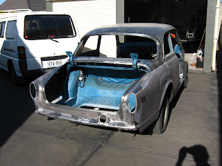 Cleaning Volvo 122S removing soda from soda blasting