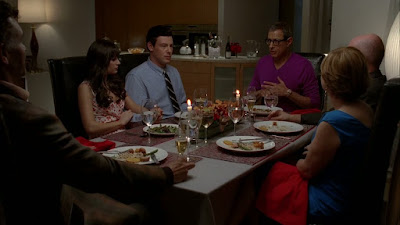 Rachel and Finn looking uncomfortably at their parents during dinner