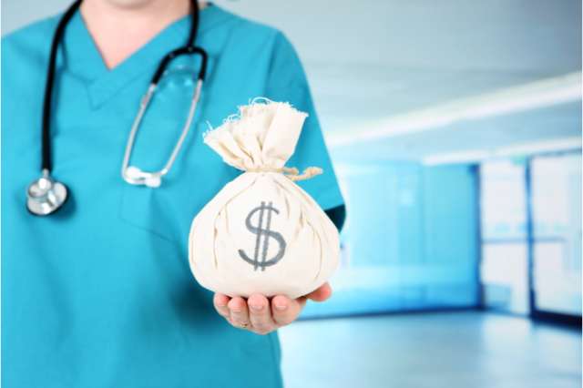 Image of a medical professional holding a bag of money.