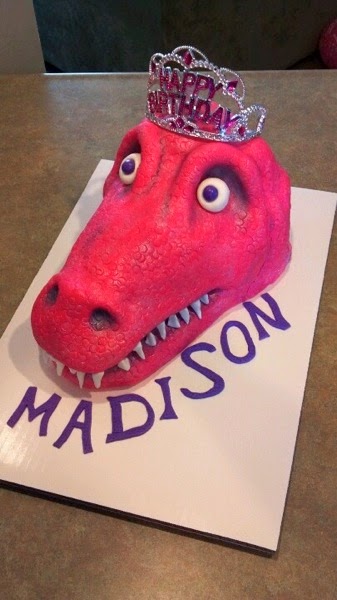 Pink princess t rex cake
