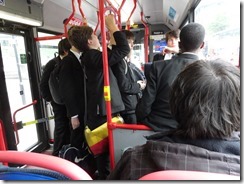 School boys on the bus going home after school - suit, white shirt and tie!