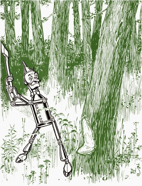 The Tin Woodman, rusted in place in the midst of swinging his axe to chop a tree.