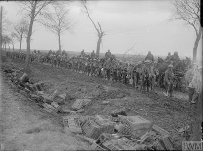 Battle of the Scarpe. Working party of British troops going up to the forward area along the Arras-Cambrai road, April 1917. © IWM (Q 2030) IWM Non-Commerical Licence